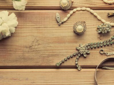 antique vintage silver jewellery on wooden table